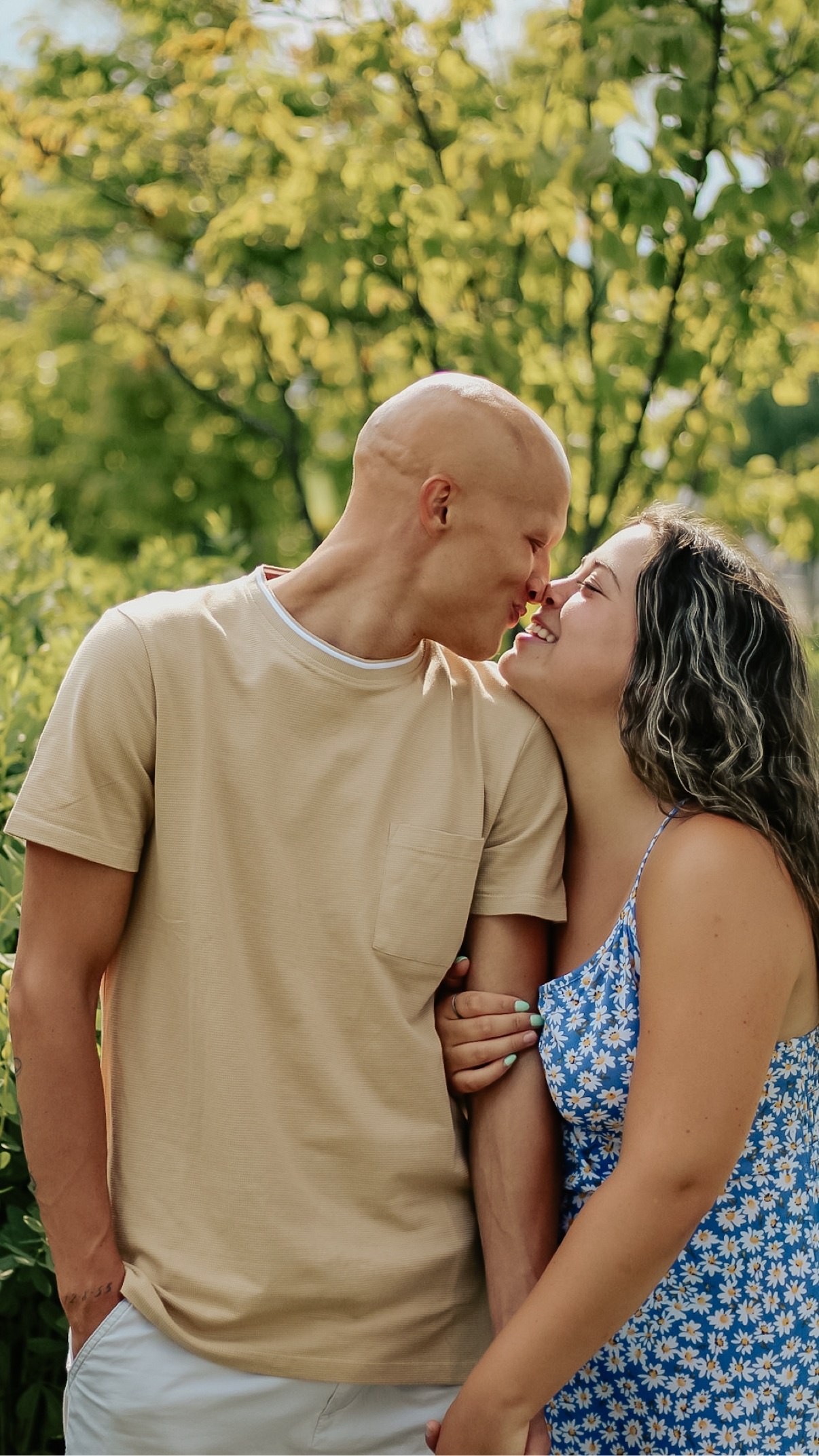 Couple smiling nose to nose outdoors